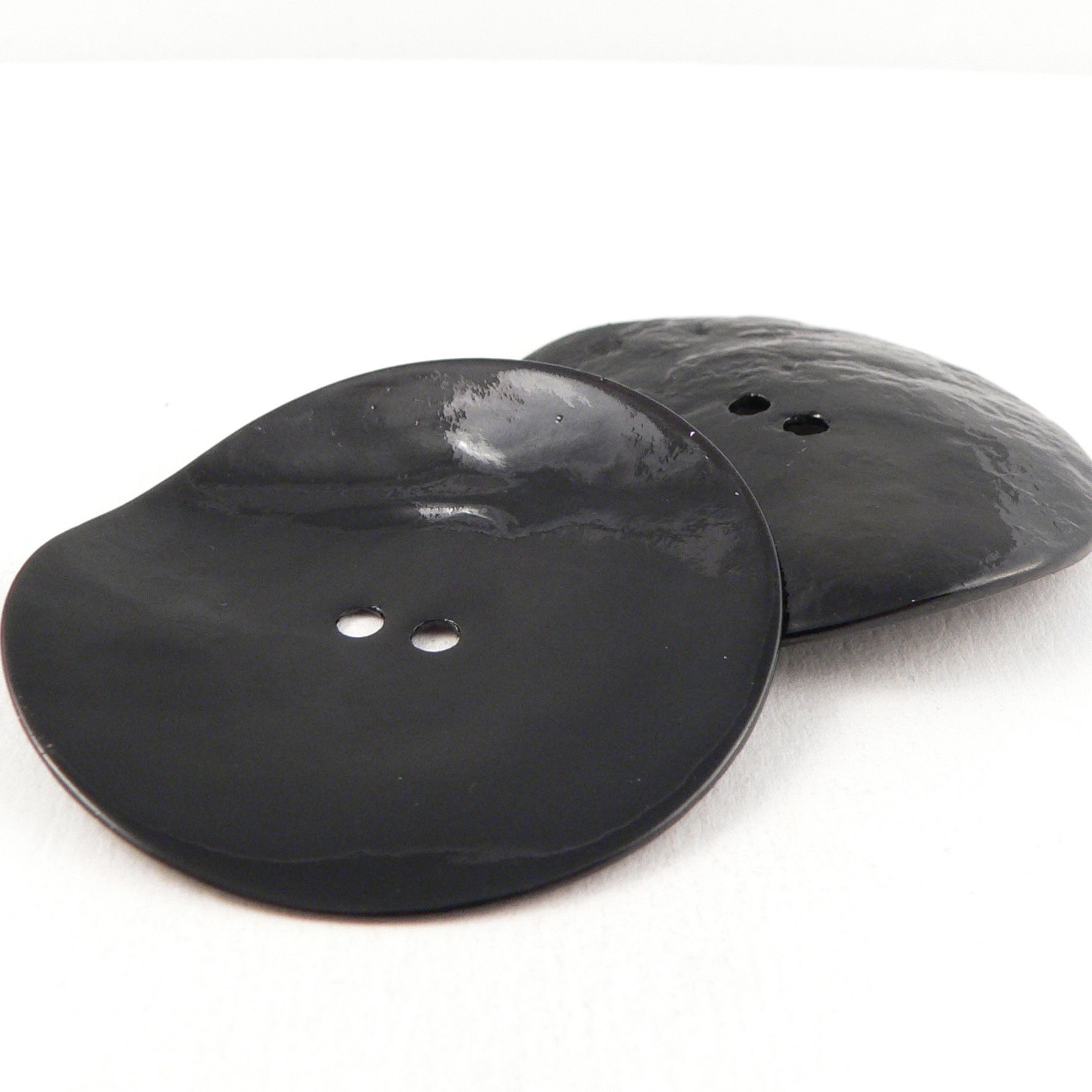 Extra large black outlet buttons